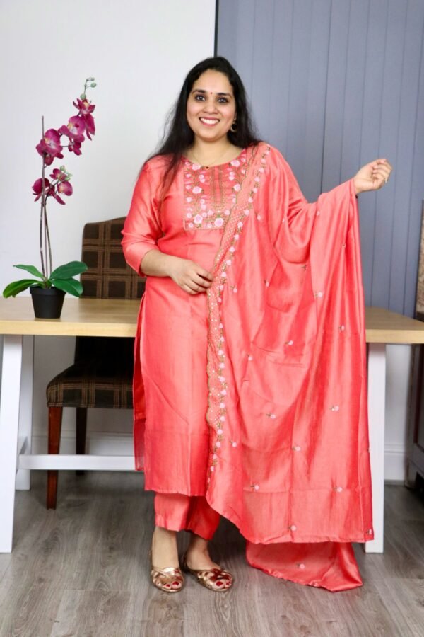Peach embroidered silk blend salwar suit with floral detailing, matching trousers, and dupatta – traditional Indian ethnic wear for women